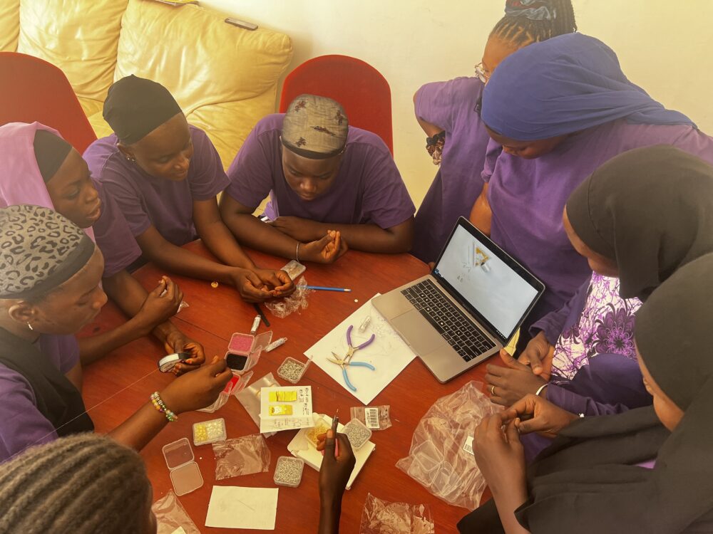 Students collaborate on creative design projects at The Gambia Academy.