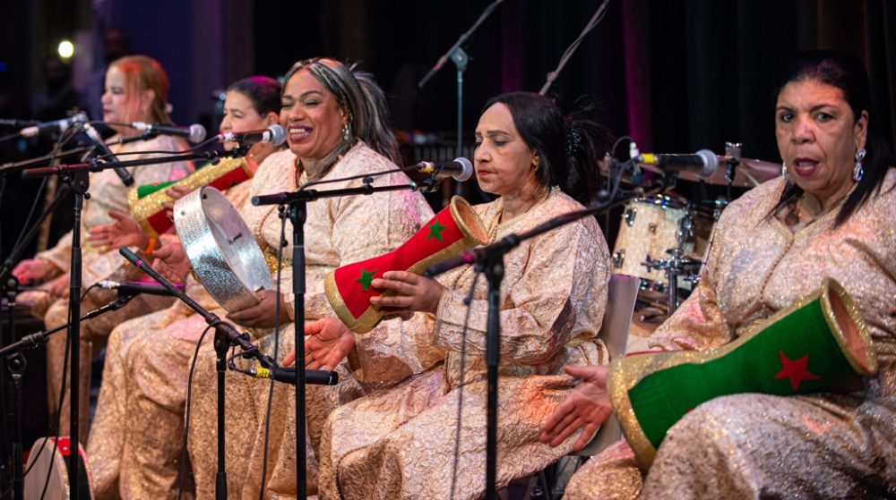 Next up, in the Promenade, a different variety of spiritual energy prevailed. Khadija el Warzazia’s Bnat el Houariyat from Marrakesh, Morocco, presented an entrancing set of "chaabi" and "houari" music, rarely heard on these shores, in the Promenade. Dancer Esraa Warda, an apprentice of Khadija’s, added a delightful element and insight into the music.