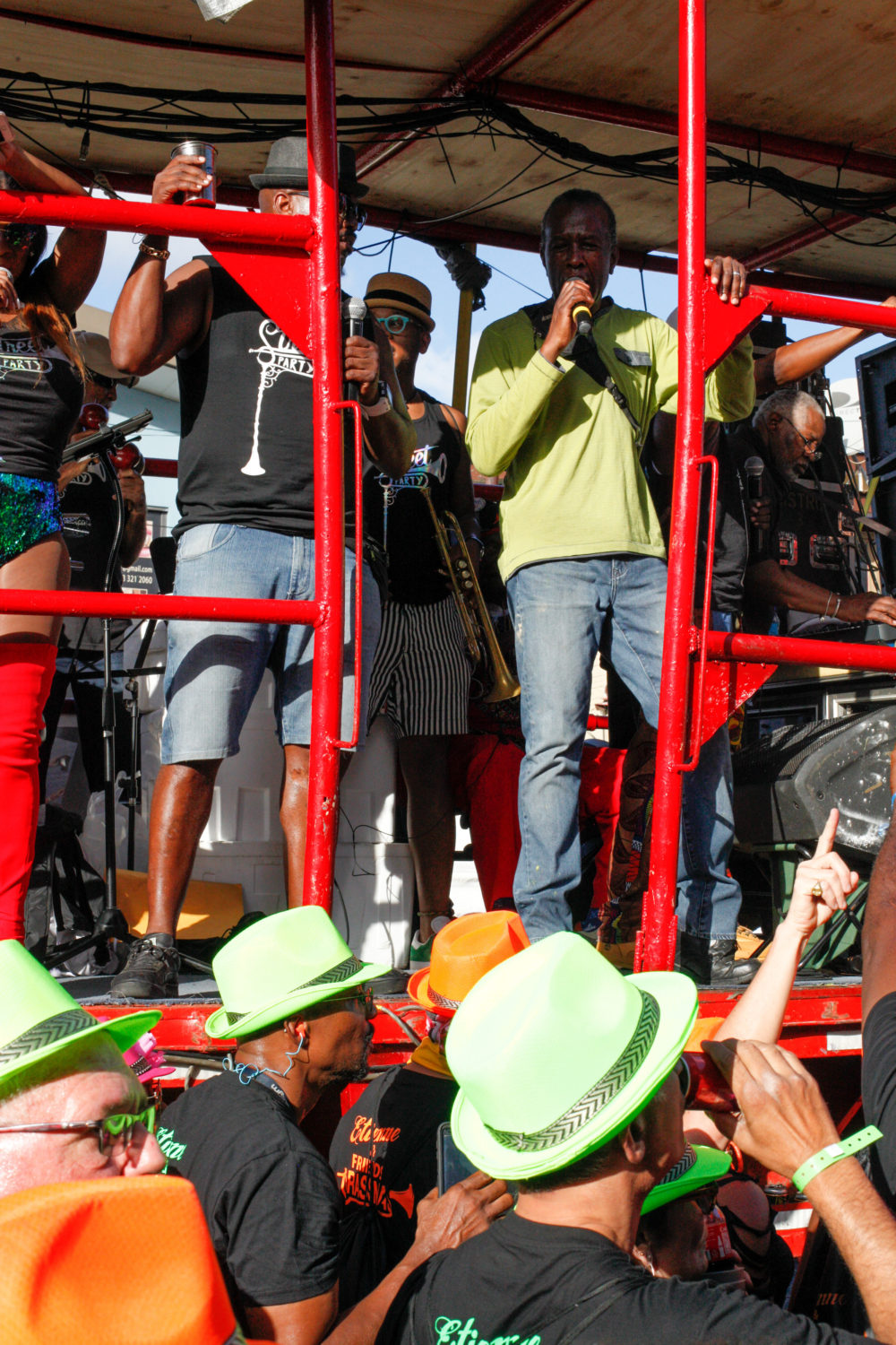 Singer David Rudder accompanies a mas band on Monday