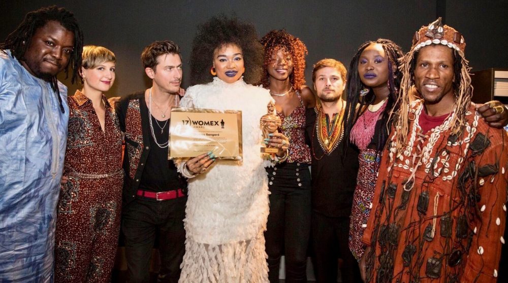 Oumou Sangaré posing with her award. Photo by Jacob Crawfurd