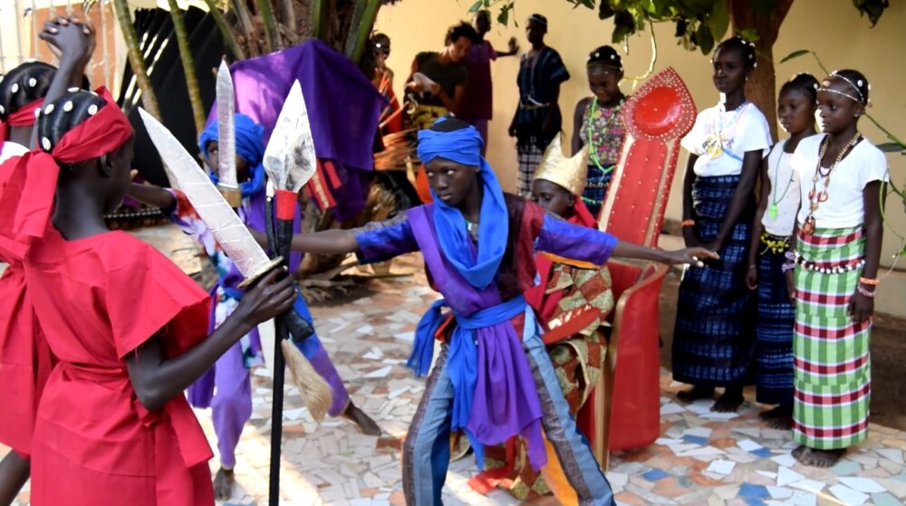 Students performing dramatic works that connect them with cultural heritage and storytelling traditions.