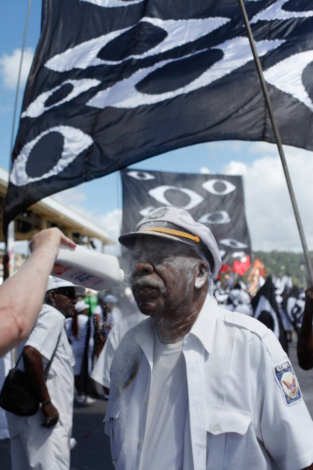 Fancy sailor getting powdered--a traditional part of this mas costume